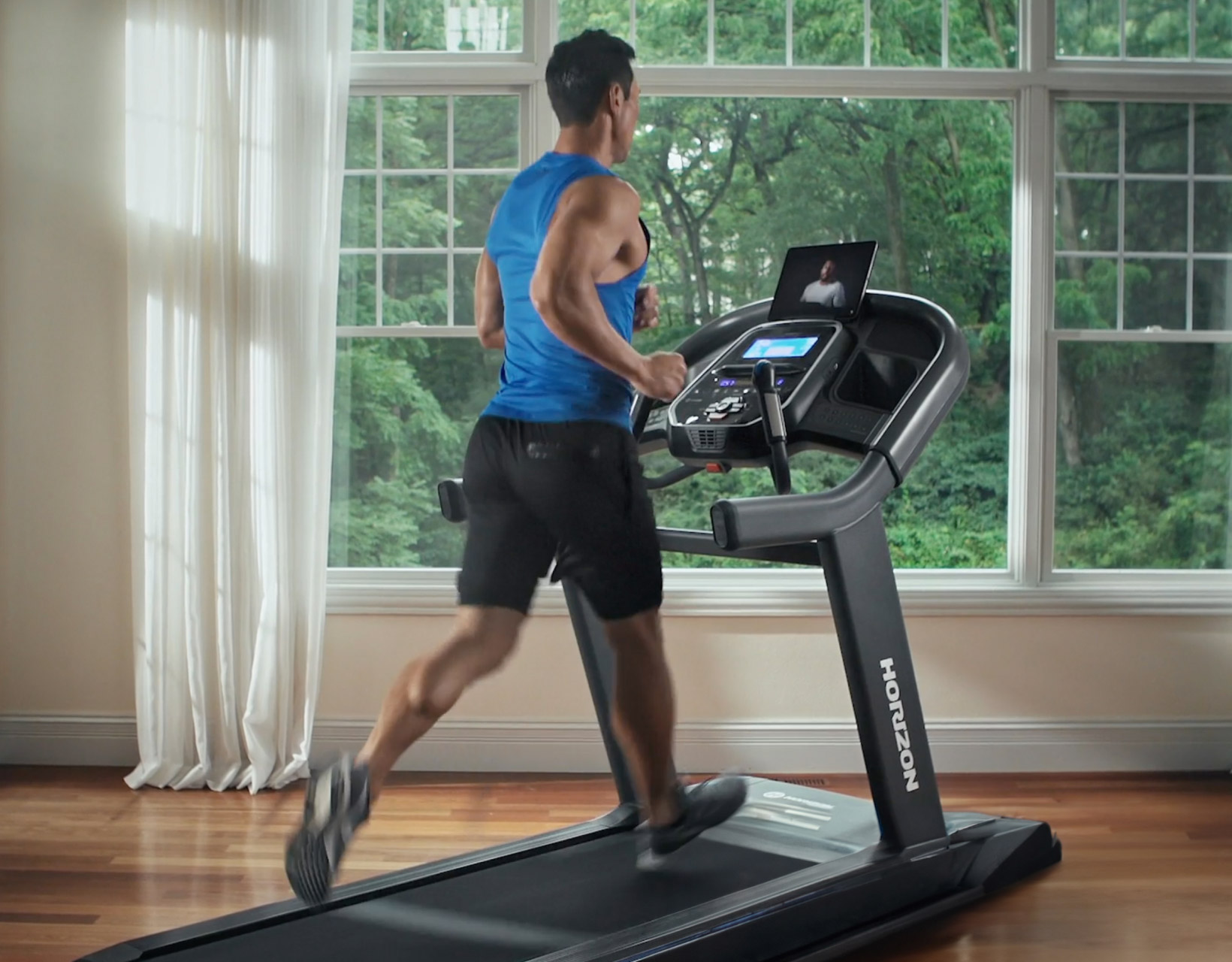 man running on tread mill